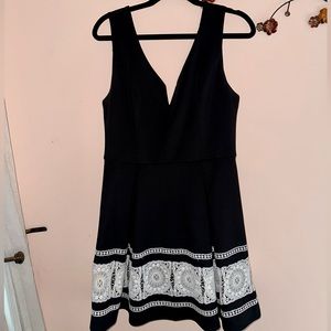 Boutique style black dress with white lace bottom